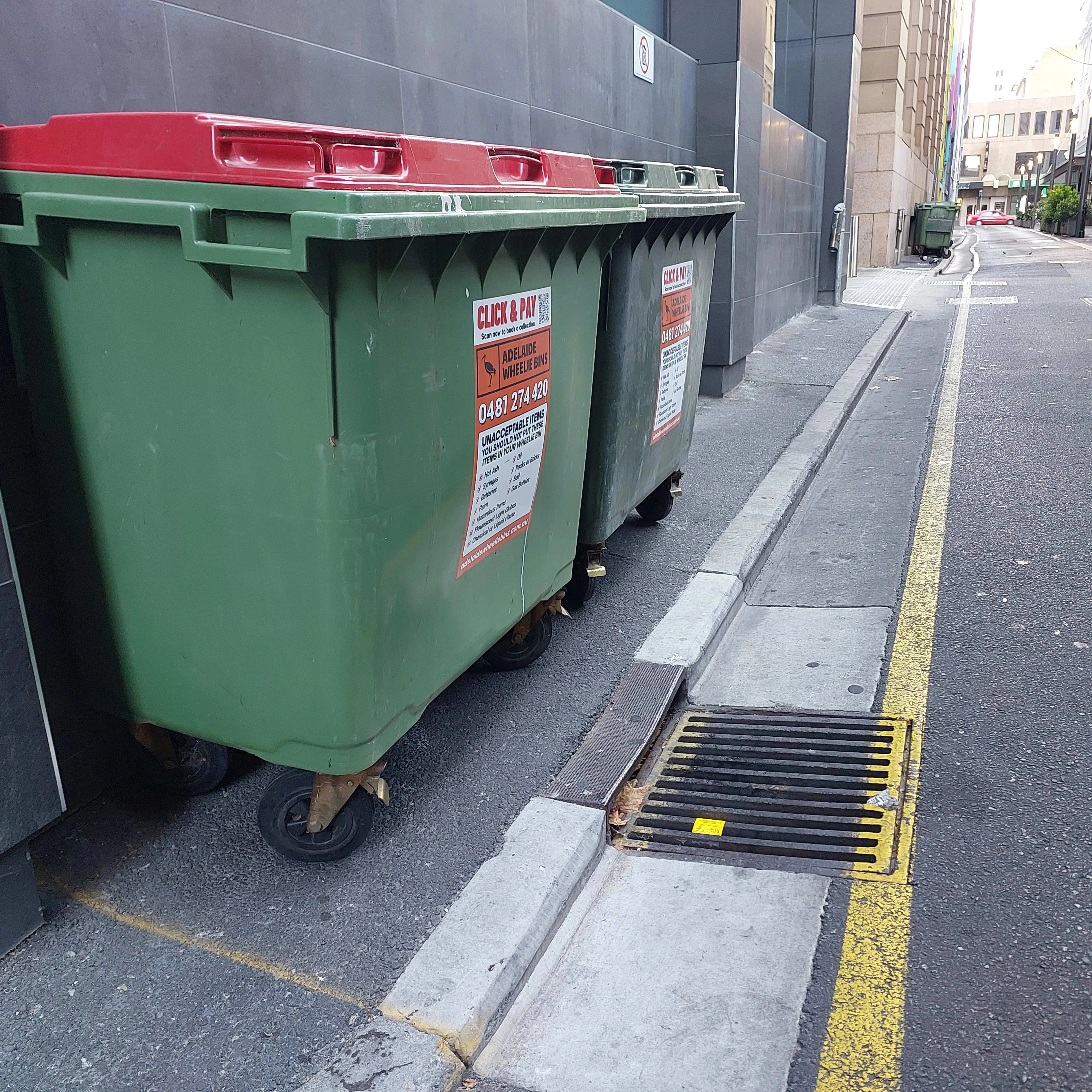 Adelaide commercial waste bins on city street - professional waste management services